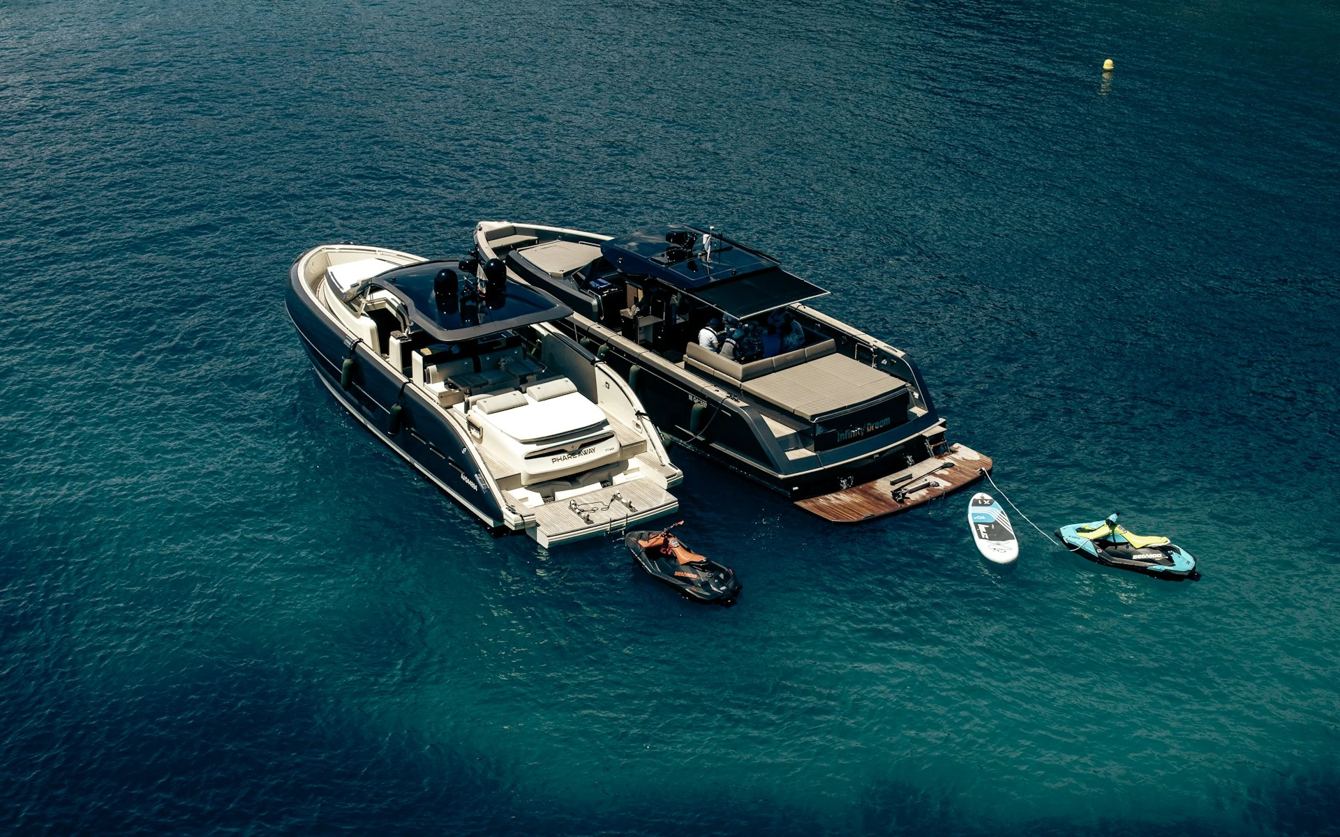 Two yachts anchored together